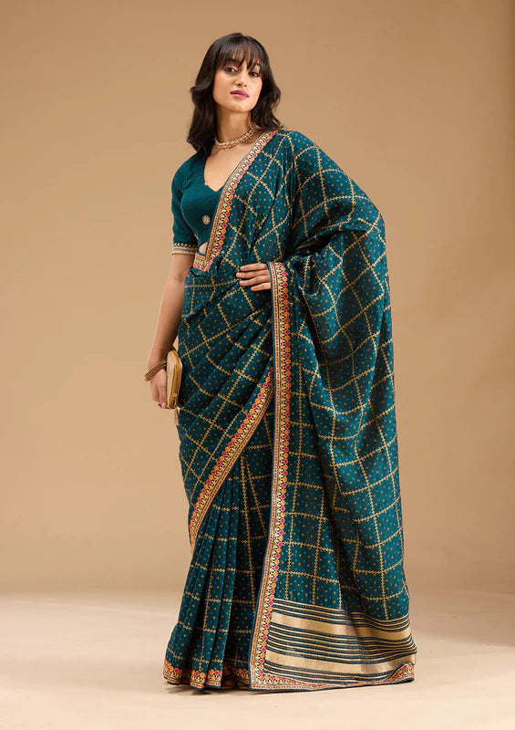 Peacock Blue Soft Raw Silk Bandhej Gold Zariwork Saree With Matching Blouse Piece