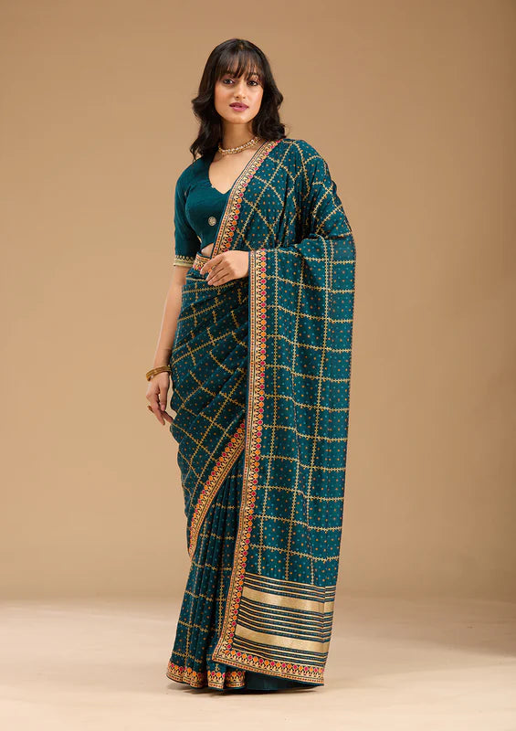 Peacock Blue Soft Raw Silk Bandhej Gold Zariwork Saree With Matching Blouse Piece