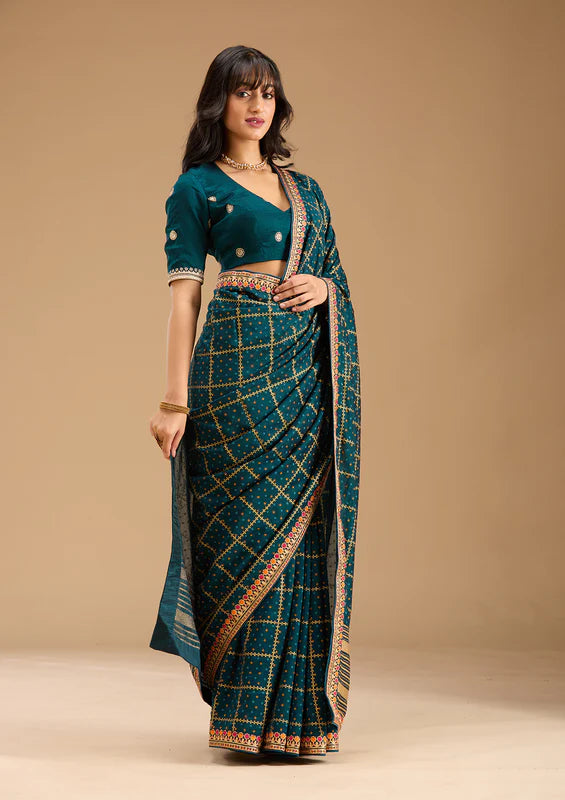 Peacock Blue Soft Raw Silk Bandhej Gold Zariwork Saree With Matching Blouse Piece