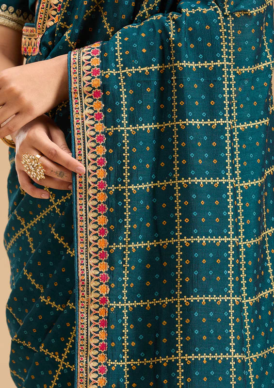 Peacock Blue Soft Raw Silk Bandhej Gold Zariwork Saree With Matching Blouse Piece